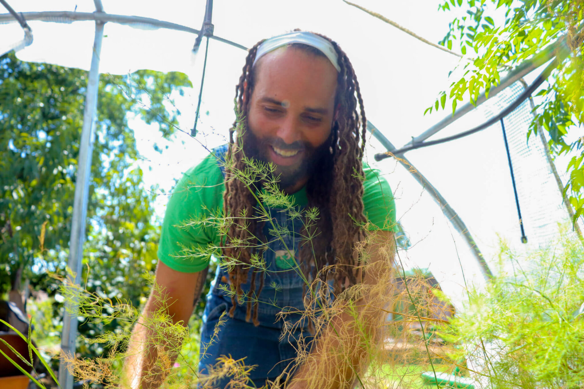 Founder and CEO, Stephen Lucke, tends to the garden at Gardopia's headquarters at 619 N New Braunfels Ave.