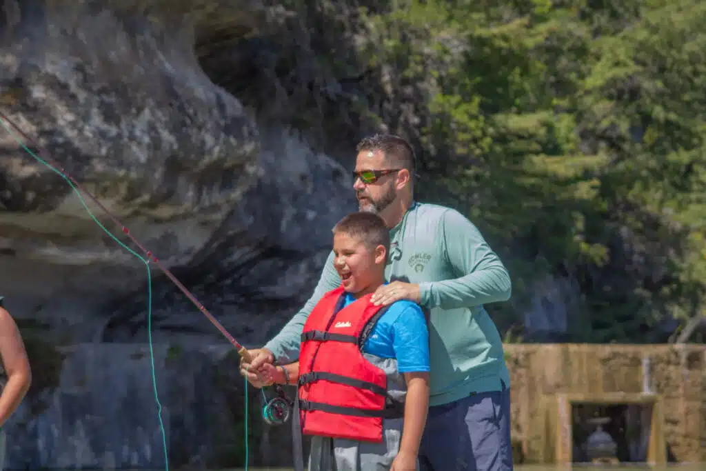 Principal Schmidt helps one of his sixth grade students at Echo Valley Waterfront.