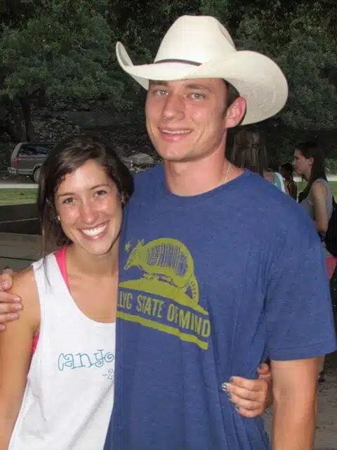 photo of couple hugging at camp